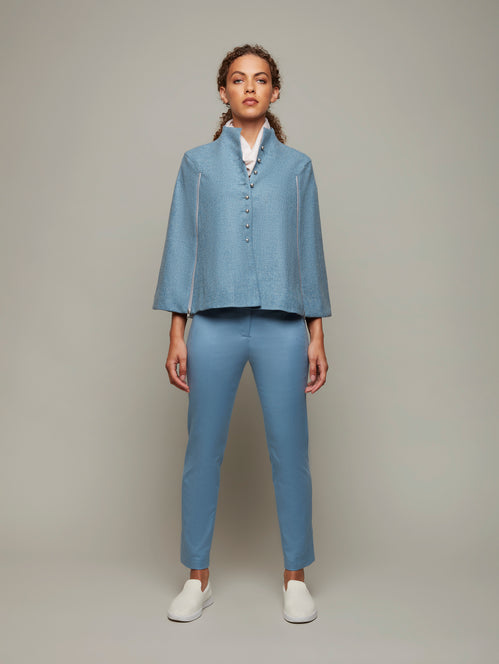 DEPLOY womenswear light blue wool tweed cape front view