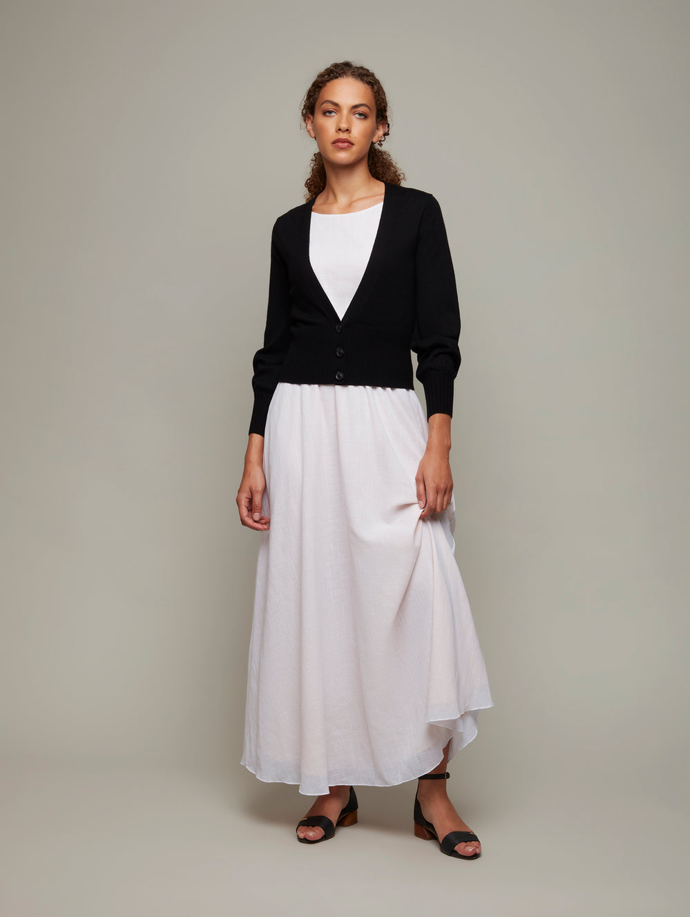 DEPLOY womenswear black fine merino knit deep-v cardigan front view