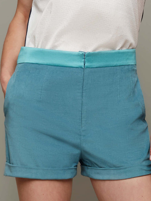 Front view of SANDBURS high waist shorts in mineral blue, available from British sustainable fashion brand DEPLOY
