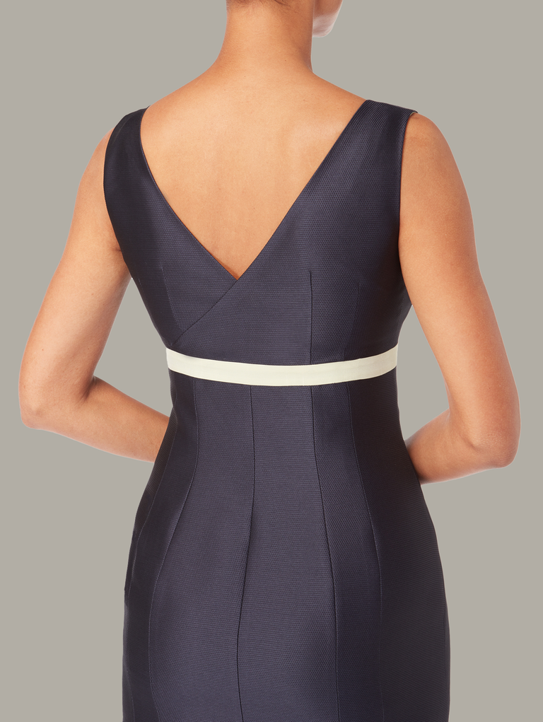 Details of back view of empire-cut fitted dress, available from British sustainable fashion brand DEPLOY