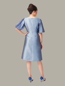 Back view of A-line cocktail dress in blue, available from British sustainable fashion brand DEPLOY