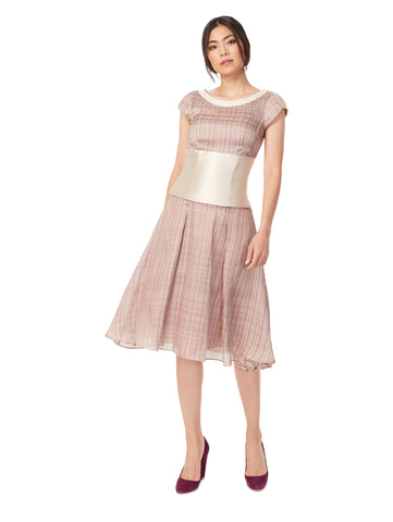 Front view of 3-way fitted waist flair dress in fig pink, available from British sustainable fashion brand DEPLOY