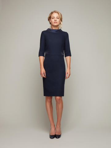 Front view of SERAC boat-collar sheath dress in Peacoat navy, available from British sustainable fashion brand DEPLOY