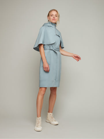 Front view of SEASON multi-way trench coat in fog blue with cape, available from British sustainable fashion brand DEPLOY