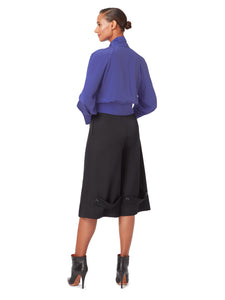 Back view of FORMERET Pin-Tuck Culottes in Black, available from British sustainable fashion brand DEPLOY